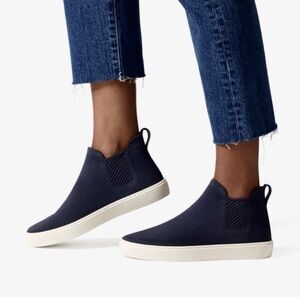 Rothys the Chelsea sneaker high top walking in navy blue